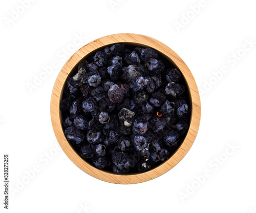 dry rot blueberry in wood bowl on white background