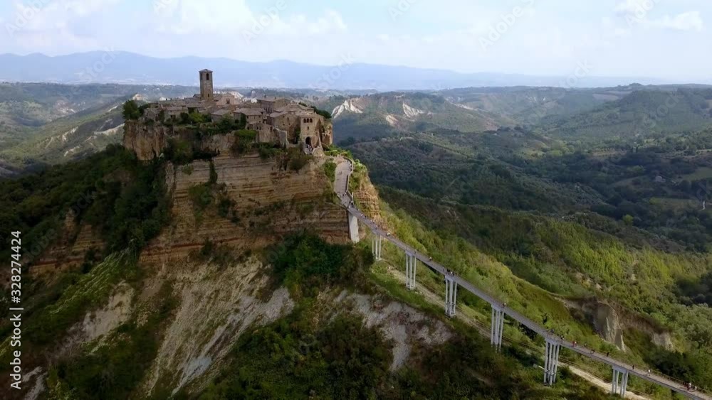 Civita di Bagnoregio village in Tuscany Italy with eroding mountainsides, Aerial dolly out shot Civita di Bagnoregio village in Tuscany Italy with eroding mountainsides, Aerial dolly out shot