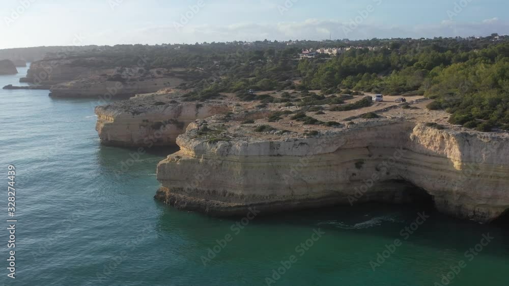 Fontainhas Beach in Portugal with camping van parked on top of eroded
