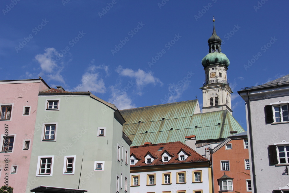 Urban European landscape with colored houses and church. Hall. Tirol. Austria