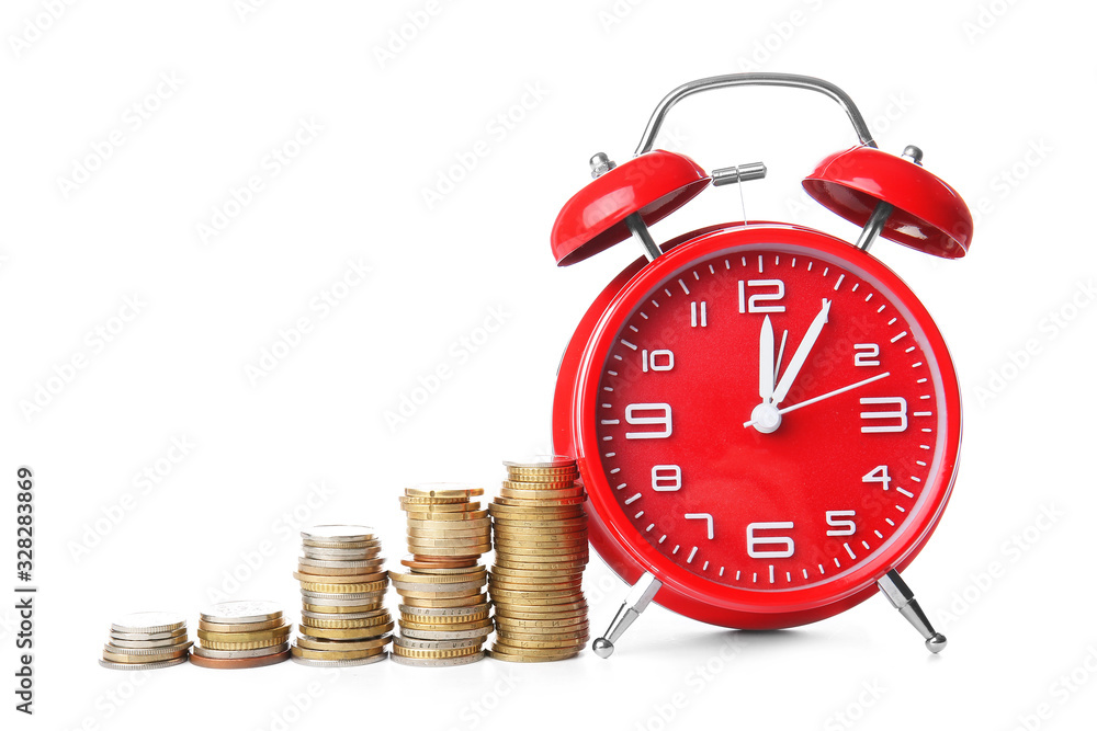 Alarm clock and coins on white background. Time management concept Alarm clock and coins on white background. Time management concept