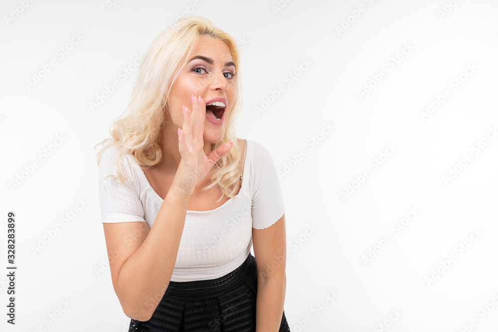 blond girl shouting news on a white studio background with copy space blond girl shouting news on a white studio background with copy space