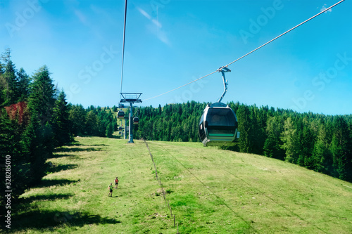 Panoramic view with cable cars in mountain and blue sky in Bad Kleinkirchheim Austria photo