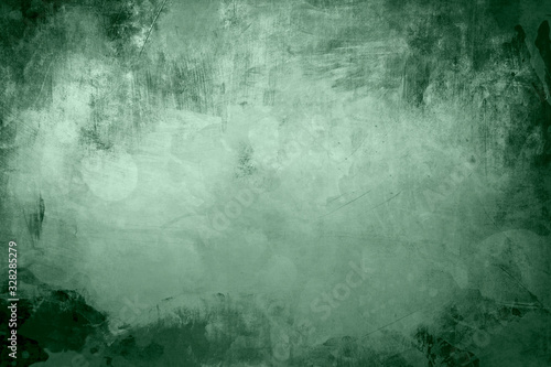 green grungy background with spotlight background