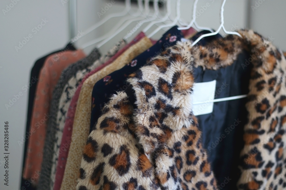 Fotografie Colorful eccentric wardrobe on a clothing rack. Selective focus.