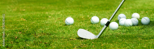 Golf iron and balls in the grass banner format