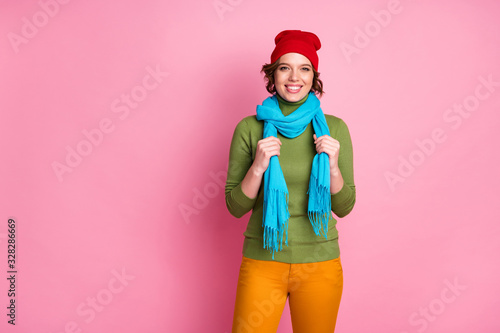 Portrait of prettty cute girl enjoy cold season walk free time touch her modern shawl wear casual style warm clothes isolated over pink color background