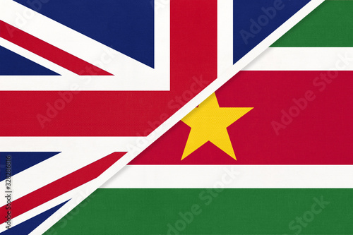 United Kingdom vs Suriname national flag from textile. Relationship between two european and american countries.