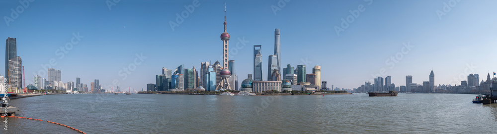 Cityscape of Shanghai at daytime. Panoramic view of Pudong's skyline from the Bund. Located in Waitan. One of the most famous tourist destinations in Shanghai.