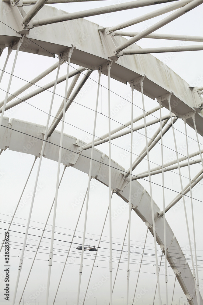 Amsterdam, Ijburg / Netherlands - February 28 2020: Enneus Heermabrug Bridge connecting Ijburg with Amsterdam Amsterdam, Ijburg / Netherlands - February 28 2020: Enneus Heermabrug Bridge connecting Ijburg with Amsterdam