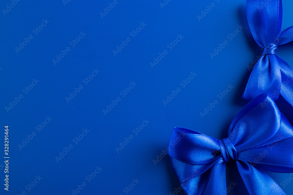 Satin ribbon of blue color in bows. Satin ribbon of blue color in bows.