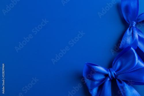 Satin ribbon of blue color in bows.