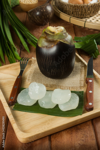 Sweet Toddy Palm and plamyra Fresh Healthy Fruits Peeled on a wooden floor plate photo