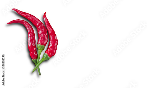 Chilies with shadow on a white background and copy space