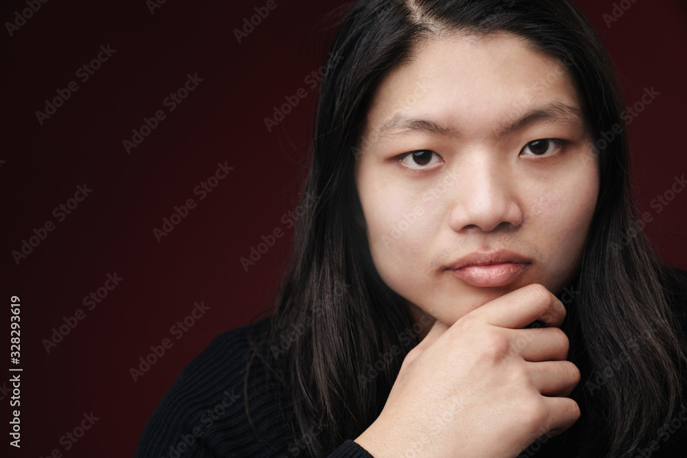 Image closeup of serious asian man posing and looking at camera Image closeup of serious asian man posing and looking at camera