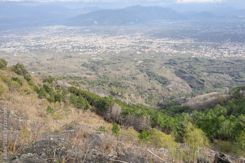 Naples, Italy - March 2020 A team of people trekking on the mountain close to Vesuvius Volcano to discover the beauty of nature and sense of a team.