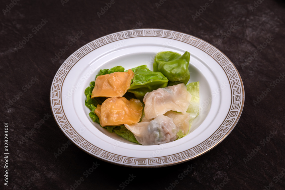 Dumplings made of vegetables of various colors are put on the plate Dumplings made of vegetables of various colors are put on the plate