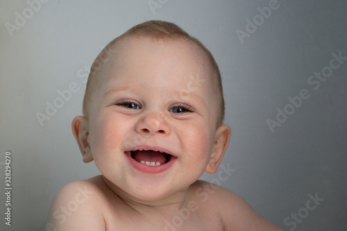 Close up portrait of smiling cute little baby  emotion  isolated pink background