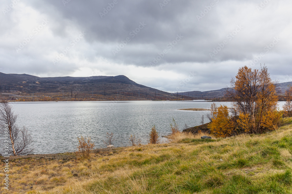 Kola Peninsula, Russia, tundra, beautiful lake, colorful autumn landscape. selective focus
