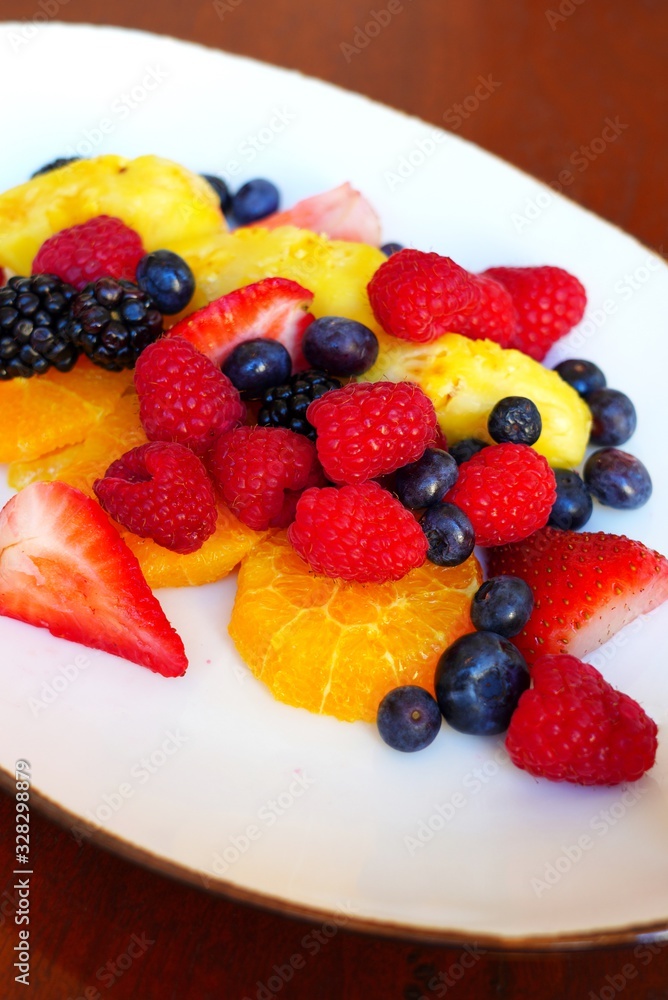 A healthy fruit plate with pineapple and berries A healthy fruit plate with pineapple and berries