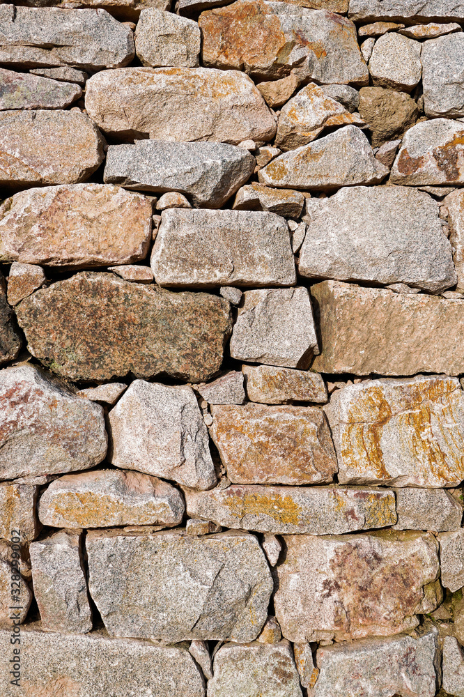 Stacked stone wall with different shaped blocks Stacked stone wall with different shaped blocks