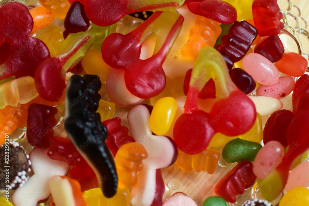 Multi-colored chewing marmalade of various shapes. Texture, background. Multi-colored chewing marmalade of various shapes. Texture, background.