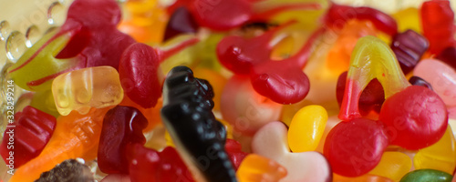 Multi-colored chewing marmalade of various shapes. Texture, background.