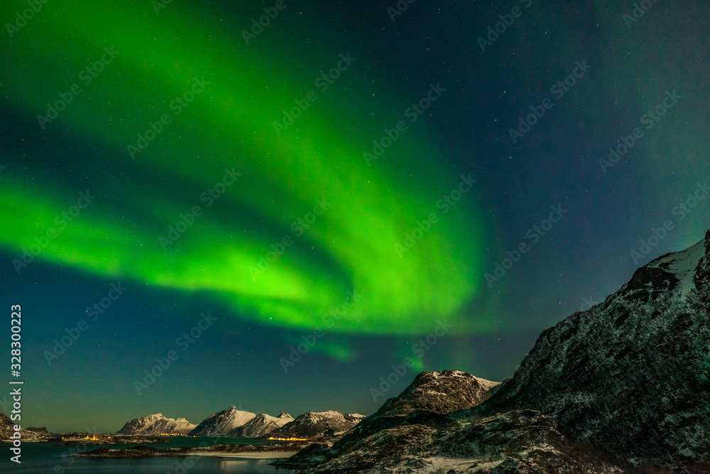 amazing polar lights, Aurora borealis over the mountains in the North of Europe - Lofoten islands, Norway