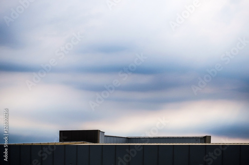 blue sky and clouds over roof top building