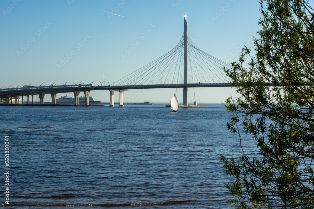 bridge over the Gulf of Finland and sailing ship on a clear Sunny day