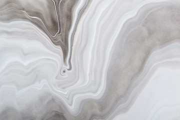 Acrylic Fluid Art. Monochrome gray waves and stains. Marble background or texture