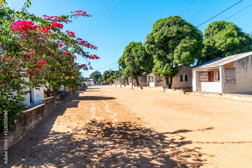 Sandy road in African neighborhood in Maputo, Mozambique