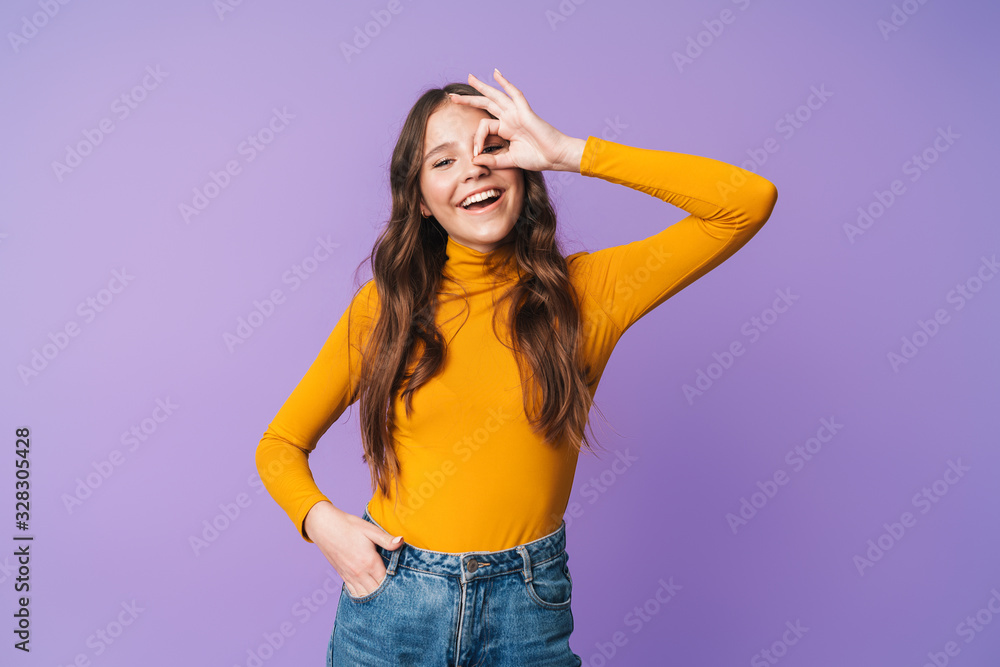 Image of young beautiful woman smiling and gesturing okay sign Image of young beautiful woman smiling and gesturing okay sign