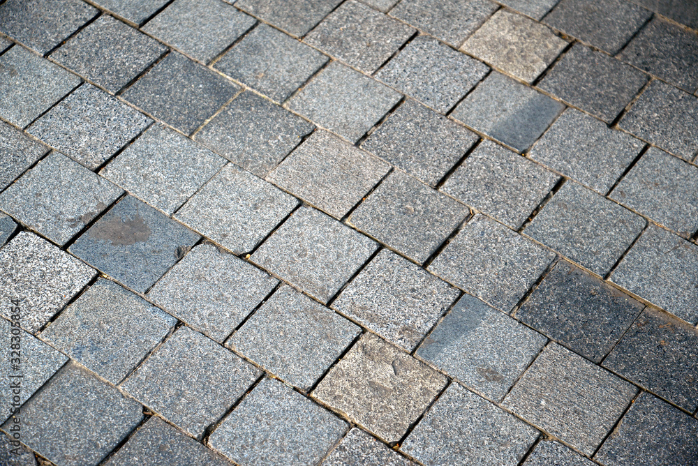 Small stone pavement of city sidewalk Small stone pavement of city sidewalk