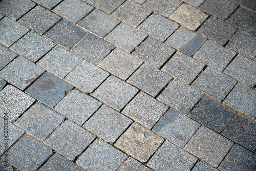 Small stone pavement of city sidewalk