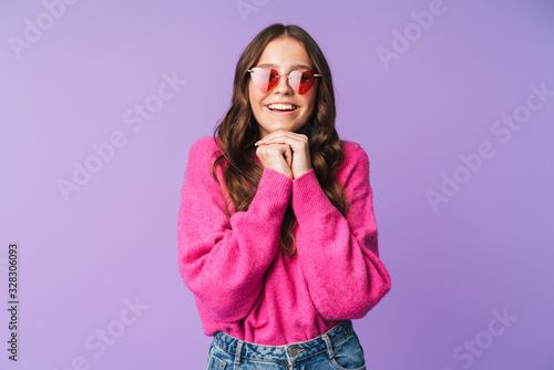 Image of young beautiful woman wearing sunglasses smiling at camera © Drobot Dean