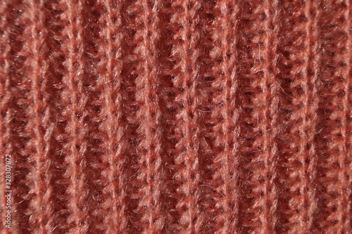 rose red background texture pattern of a sample of knitted wool fabrics