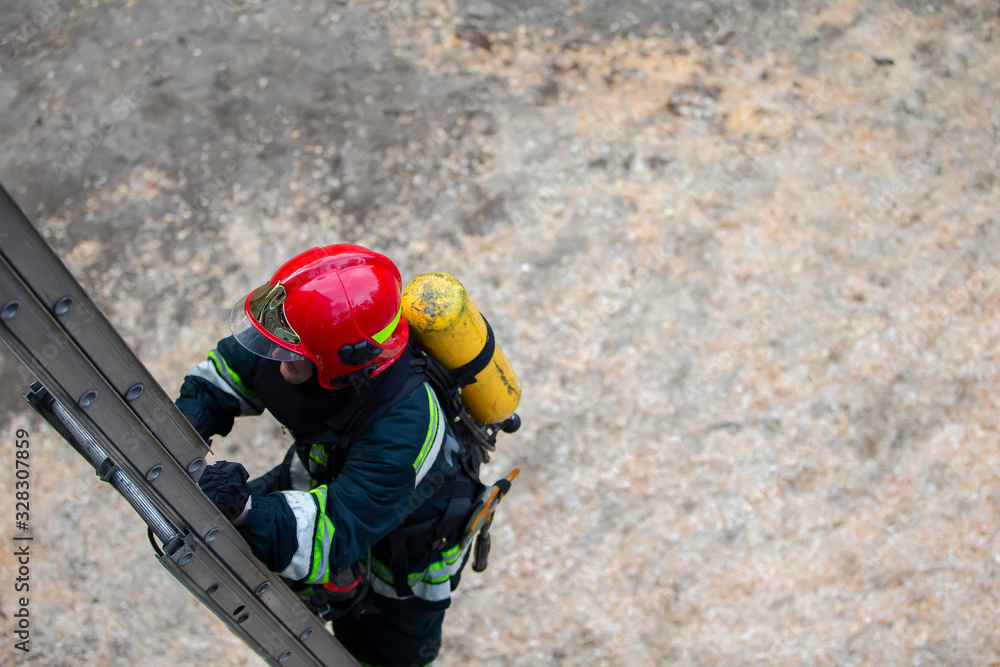 Firefighter climbs the stairs. Lifeguard training. Firefighter climbs the stairs. Lifeguard training.