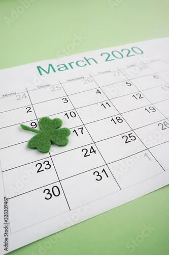 March 17 is St. Patrick's Day. The date is marked in the organizer with a clover leaf. Close-up shot.