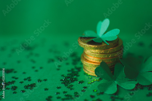 Photography Saint Patricks day backdrop with close up stack of chocolate coins with green fo