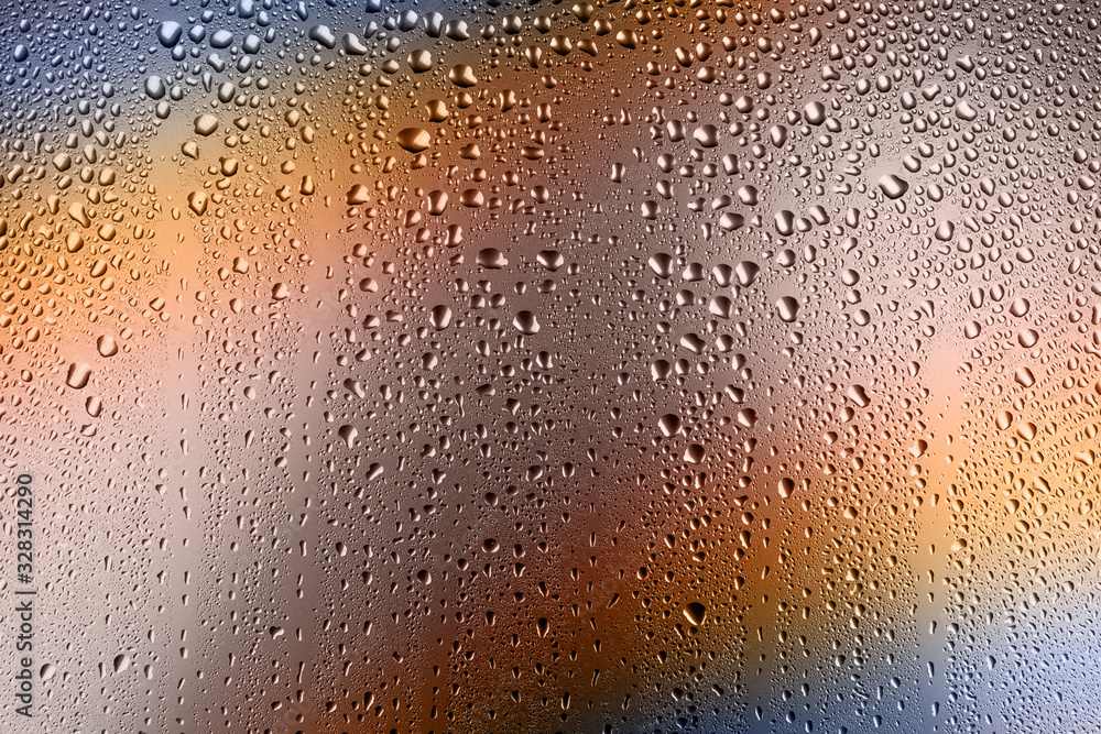 texture of large and small drops of water on a matte surface with color shades