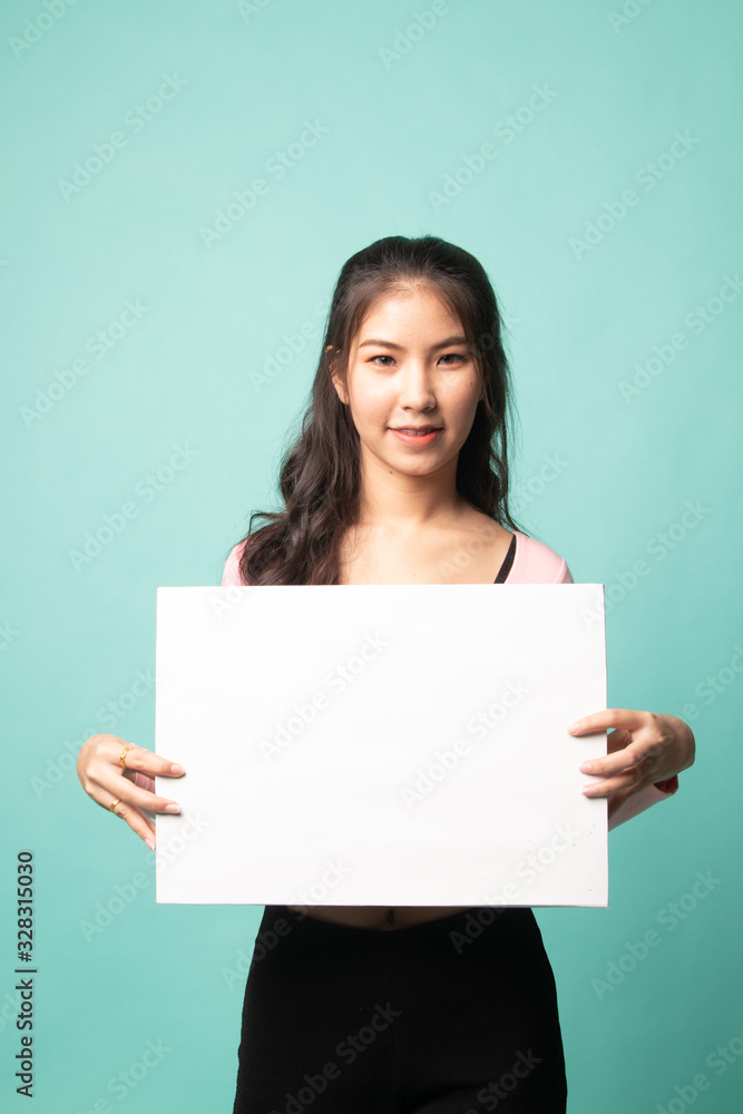 Young Asian woman with white blank sign. Young Asian woman with white blank sign.