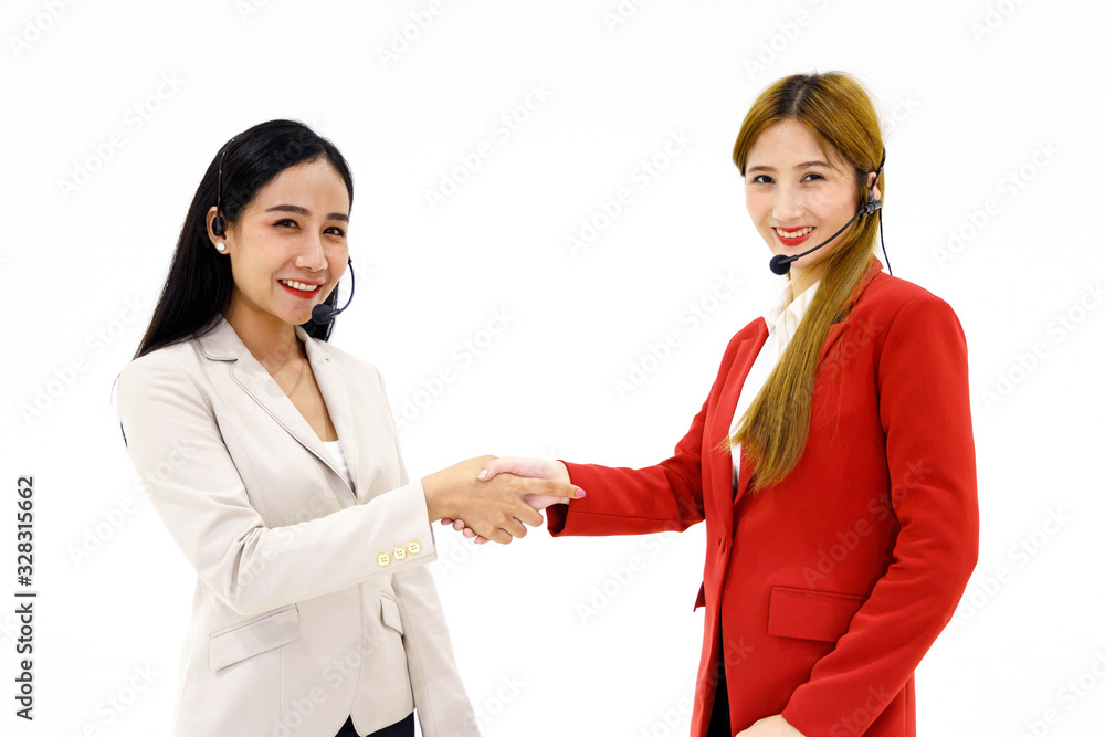 Two happy Asian call center operator shaking hand each other on white background. Two happy Asian call center operator shaking hand each other on white background.