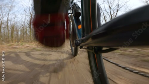 pedaling on bike in early spring park