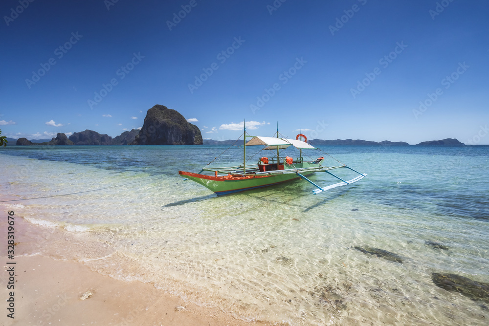 Traditional banca boats on beautiful Corong beach, El Nido . Palawan, Philippines. Summer exotic vacation and tourism concept