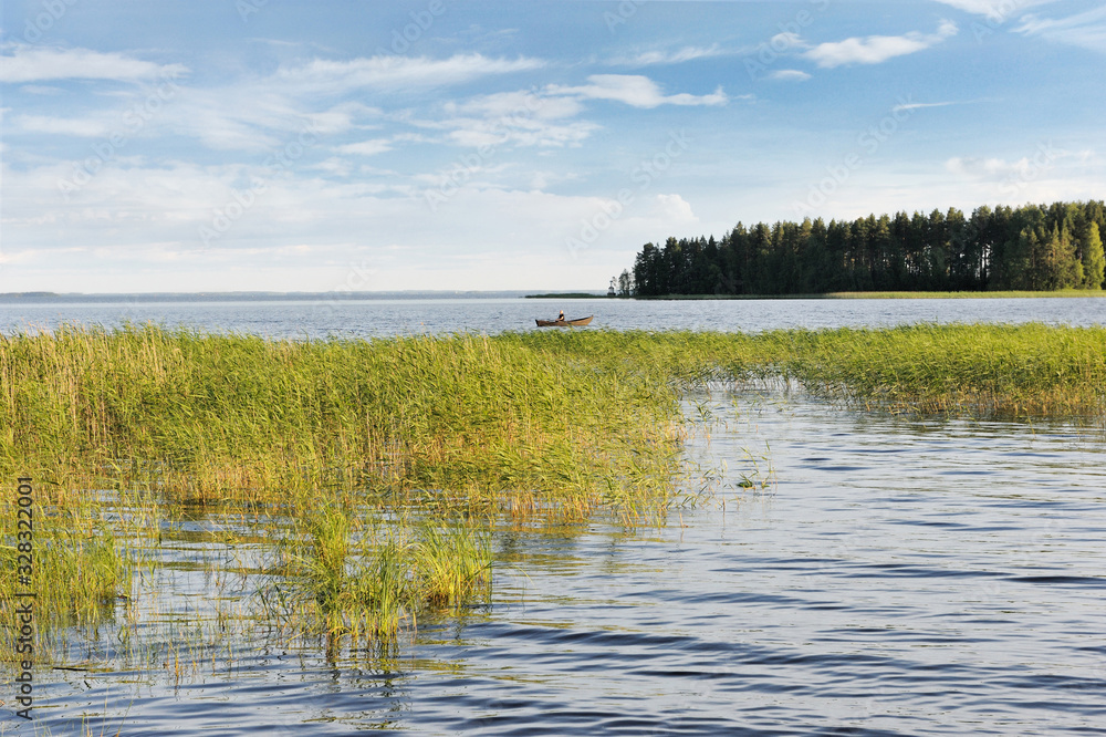 Boating in the Lake Pyhaselka, Joensuu, Northern Karelia, Finland at Summer Afternoon in August 2019