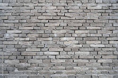 Rough dark gray building brick wall background