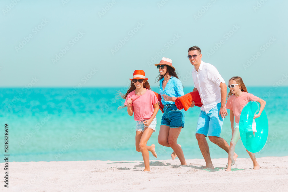 Photo of happy family having fun on the beach. Summer Lifestyle