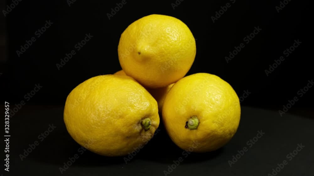 Orange fruit rotating on a black background. Close up Orange fruit rotating on a black background. Close up