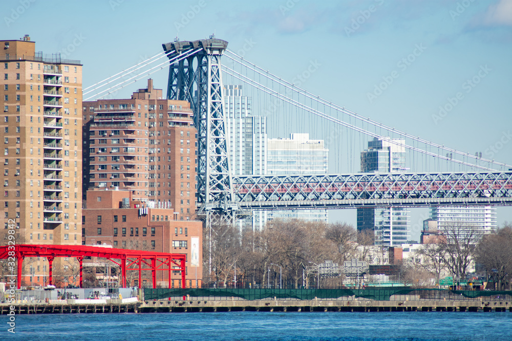 Lower East Side New York City Waterfront along the East River with the Williamsburg Bridge